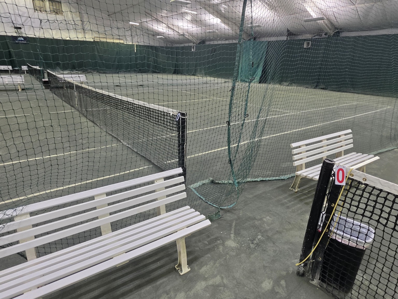 Benches and seating beside the indoor tennis courts