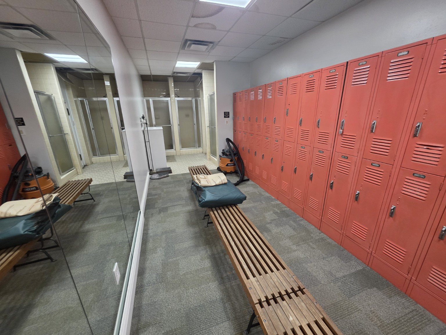 Lockers and changing benches in the men's locker room