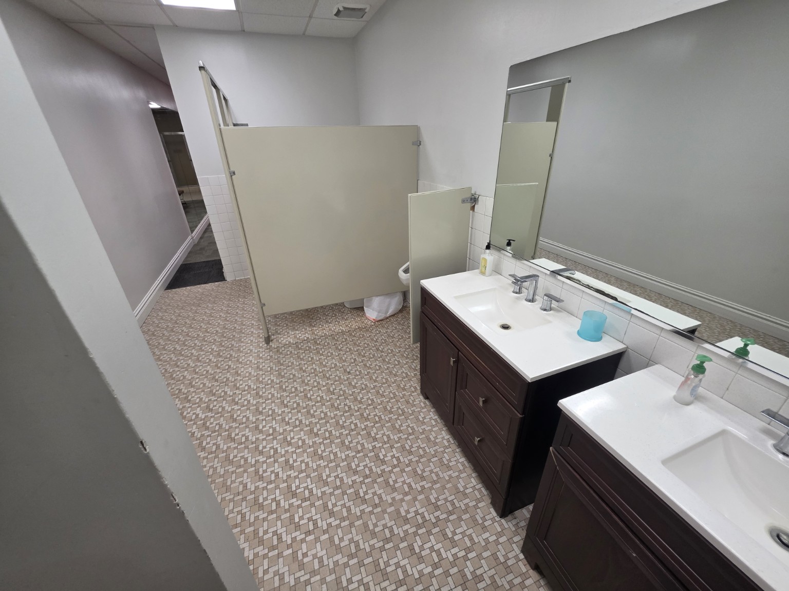 Sinks and restroom facilities in the men's locker room